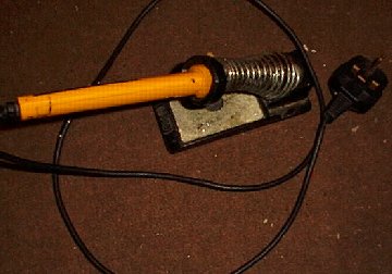 Soldering iron in a stand
